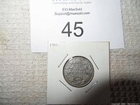 Front face of 1912 Canadian silver 25 cent coin in protective holder