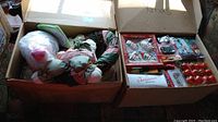 Overview of lot showing wreath, plush bunnies, boxes of ornaments