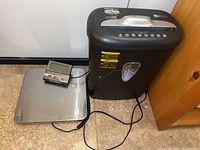 Photo showing both shredder and digital scale with LCD display and stainless steel platform