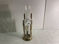 Front view of the antique silver plated cattail vase showing the full shape and design with the glass insert inside.
