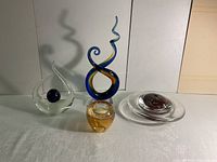 All four art glass pieces