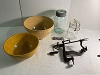 Overview photo showing all items including apple peeler, two bowls, two mason jars, and Madeleine molds.