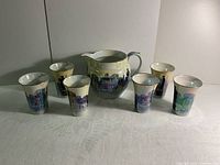 Front view of the lemonade set displaying pitcher and six cups with colorful country lovers design.