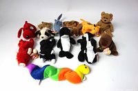 Photo showing all 12 Beanie Babies displayed on a white background with original Ty tags visible.