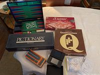 Wide view showing the lot of games and Nintendo DS Lite on a table.