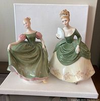 Photo of both Michele and Soiree Royal Doulton figurines together on a white background.