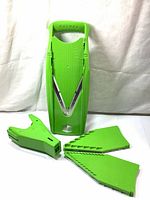 Front view of Borner V Power Mandoline V-Slicer with hand guard and blade inserts