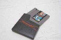 Full view of the Nintendo NES game cartridge showing the 2-in-1 Super Mario Bros and Duck Hunt label and the Nintendo logo on the cartridge casing.