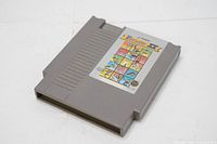 Gray NES cartridge front with Track & Field II label featuring sports illustrations and Nintendo branding.