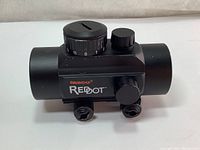 Front side view of the Tasco ProPoint red dot scope showing adjustment knobs and branding.