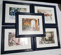 Five framed prints arranged closely, showing winter and home-related scenes