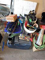 Overview of lot items including cordless drills, cords, hardware containers, and assorted tools.