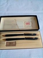 View of the new Cross Classic Black pen and pencil set in cream insert case with black outer box, showing both the pen and pencil and Cross branding.
