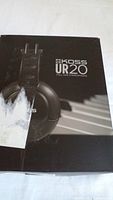 Box of Koss UR20 full size stereo headphones showing model and brand.