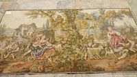 Full view of the tapestry showing children sitting under a tree with animals and countryside house in the background