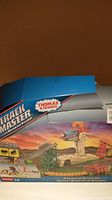 Box front view showing Thomas and Friends Trackmaster Avalanche Escape Set with mountain and track images