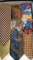 Five SilkMost men's silk ties laid flat showing diverse patterns and colors including floral, geometric, and illustrated design.