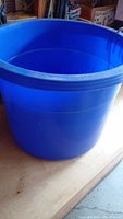 Photo of the large blue plastic utility tub showing the full tub with handles.