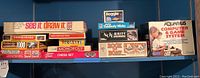 Shelf overview with boxed games and puzzles arranged side by side