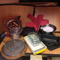 Full view of all items in the kitchenware set including glass dishes, pans, mitts, and grill accessories.