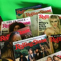 Collection of vintage Rolling Stone magazines with various notable cover images including musicians and celebrities.