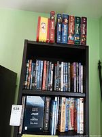 Three shelves filled with DVDs including BBC Natural History Collection, other assorted titles, and some boxed collections.