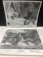 Multiple black and white Walt Disney production photos showing various animated scenes including characters in bedroom and castle settings
