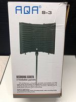 Photo of the original AQA S-3 packaging box showing the 3 foldable panel recording screen on a stand.