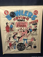 Full view of the vintage linen towel with colorful bowling-themed cartoons and the text 'Bowlers Crying Towel' prominently displayed.