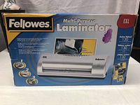 Box of Fellowes EXL Multi-Purpose Laminator showing front view with branding and key product features.