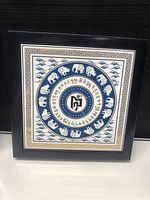 Front view of Feng Shui plaque showing full circular design and border.