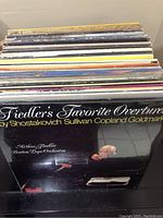 Photo of vinyl records with front album titled 'Fiedler's Favorite Overtures' by Arthur Fiedler and Boston Pops Orchestra.