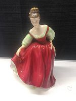 Front view of the figurine showing detailed face and dress