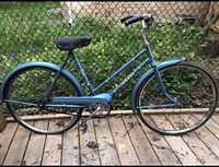 Side view of the full vintage CCM Breeze bicycle showing frame, tires, saddle, and handlebars.