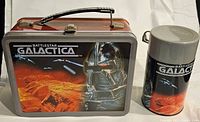 Front view of lunchbox and thermos showing artwork and design.