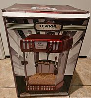 Box of the Classic Elite Popcorn Maker showing packaging design and model details.