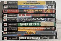 Stack of 10 PlayStation 2 game cases showing spines with titles: Star Wars: The Force Unleashed, Theme Park: Roller Coaster, LEGO Star Wars, ATV Offroad Fury 2, Aggressive Inline, World Series of Poker, NPPL Championship Paintball 2009, Pac-Man World 2, Grand Theft Auto: San Andreas.