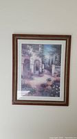 Full front view of one framed print showing classical garden with arches