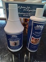Photo of two bottles, UV3 Fabric Protection and Leather Cleaner and Conditioner, showing front labels.