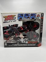 Front of boxed Air Hogs RC Elite Helix X4 Stunt drone showing product branding, stunt features, and included items.