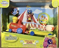Front of boxed Backyardigans Bobblin Big Top musical circus train toy showing train engine, Pablo figure, drum, and flatcar inside packaging.