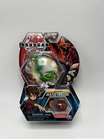 Front packaged view of Bakugan Battle Planet Ventus Fangzor with BakuCores and character card visible.