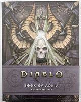 Front cover of the Diablo: Book of Adria hardcover book showing skull with horns and book title.