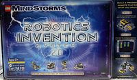Box front showing Lego Mindstorms Robotics Invention System 2.0 set title, 718 pieces, recommended age 12+. Lightning and robotic images on box.