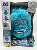 Front view of the Sulley monster mask in original box showing face and features.
