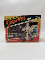 Front of box showing Motorized Capsela 175 with colorful images and text highlighting science projects and motorized function.