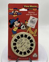 Front photo of new sealed View-Master reels package with Mickey and the Seal illustration, showing reels and price sticker