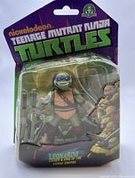 Front of sealed blister packaging showing Leonardo figure with katana swords and Nickelodeon Teenage Mutant Ninja Turtles branding.