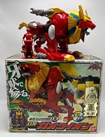 DX GaoLion figure standing on its original box, with red ranger figure beside it, demonstrating size and completeness.
