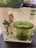 Photo of the Diana Home Sauna Steamer in its original box showing product image and branding with Asian characters.